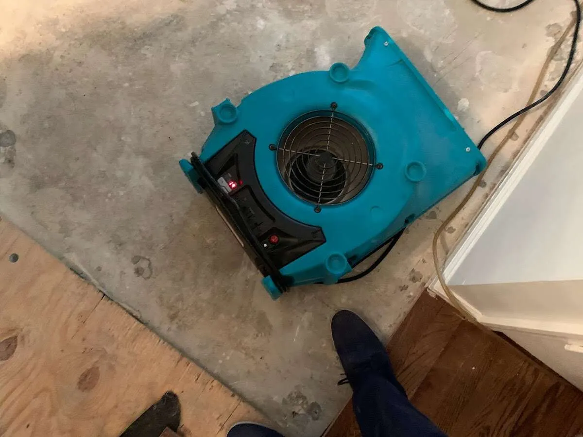 Air mover drying subfloor during Leak Detection & Repair in Aliso Viejo